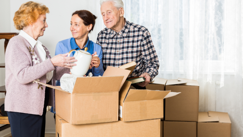 seniors decide which items to keep from their boxes